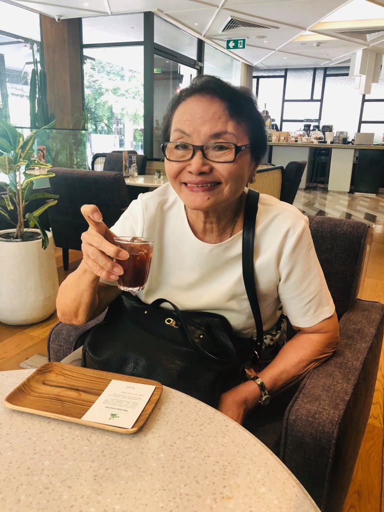 Ama sipping a drink at the hotel.