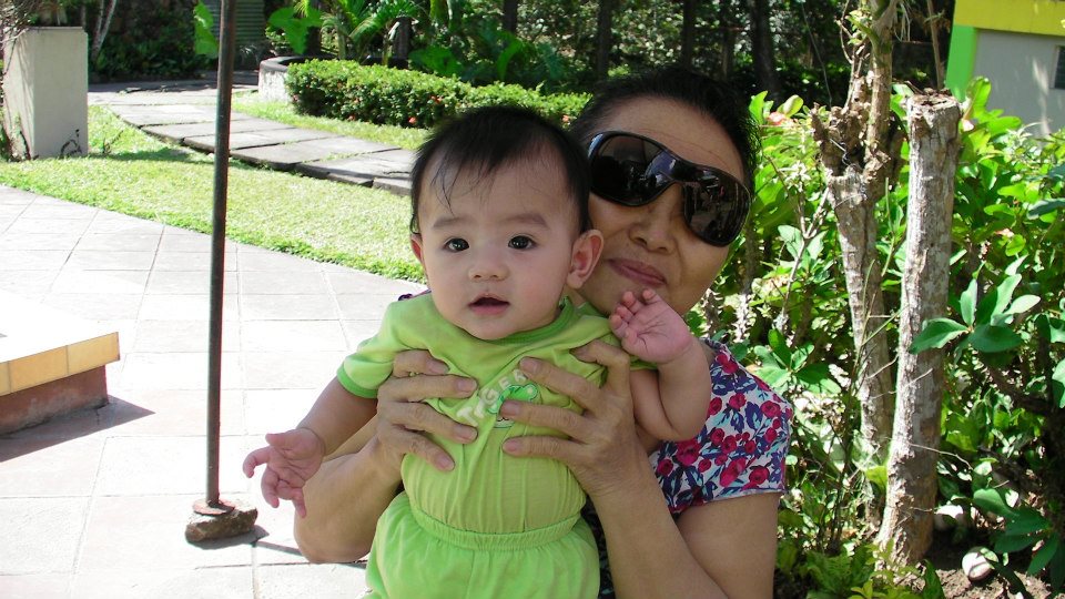 Ama holding Cyrus baby